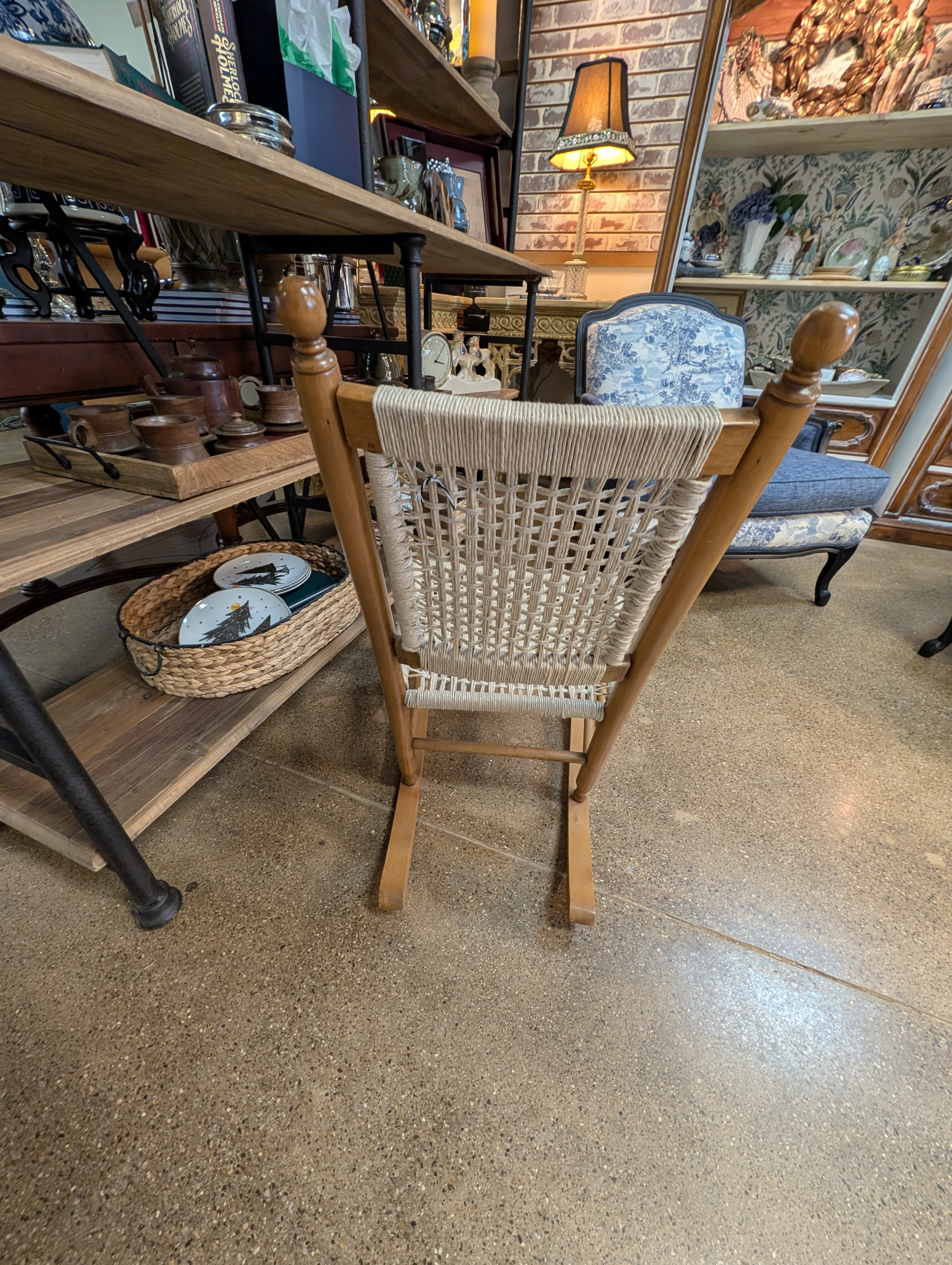 https://chairish-prod.freetls.fastly.net/image/product/master/eb315c09-b421-46b1-bdd9-5114c37c1412/restored-vintage-childs-rocking-chair-with-hand-woven-macrame-seat-1062