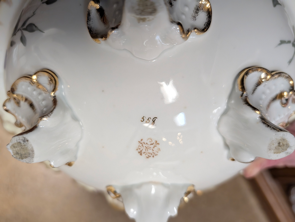 https://chairish-prod.freetls.fastly.net/image/product/master/1ba5ad26-a066-4299-b223-a3600e64e5d6/vintage-hand-painted-hollywood-regency-porcelain-centerpiece-bowl-with-gilt-trim-and-floral-motif-2059
