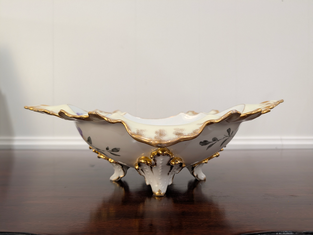 https://chairish-prod.freetls.fastly.net/image/product/master/f6f2bfec-1af6-490d-b4ef-f7f8cd5f7b7b/vintage-hand-painted-hollywood-regency-porcelain-centerpiece-bowl-with-gilt-trim-and-floral-motif-9994