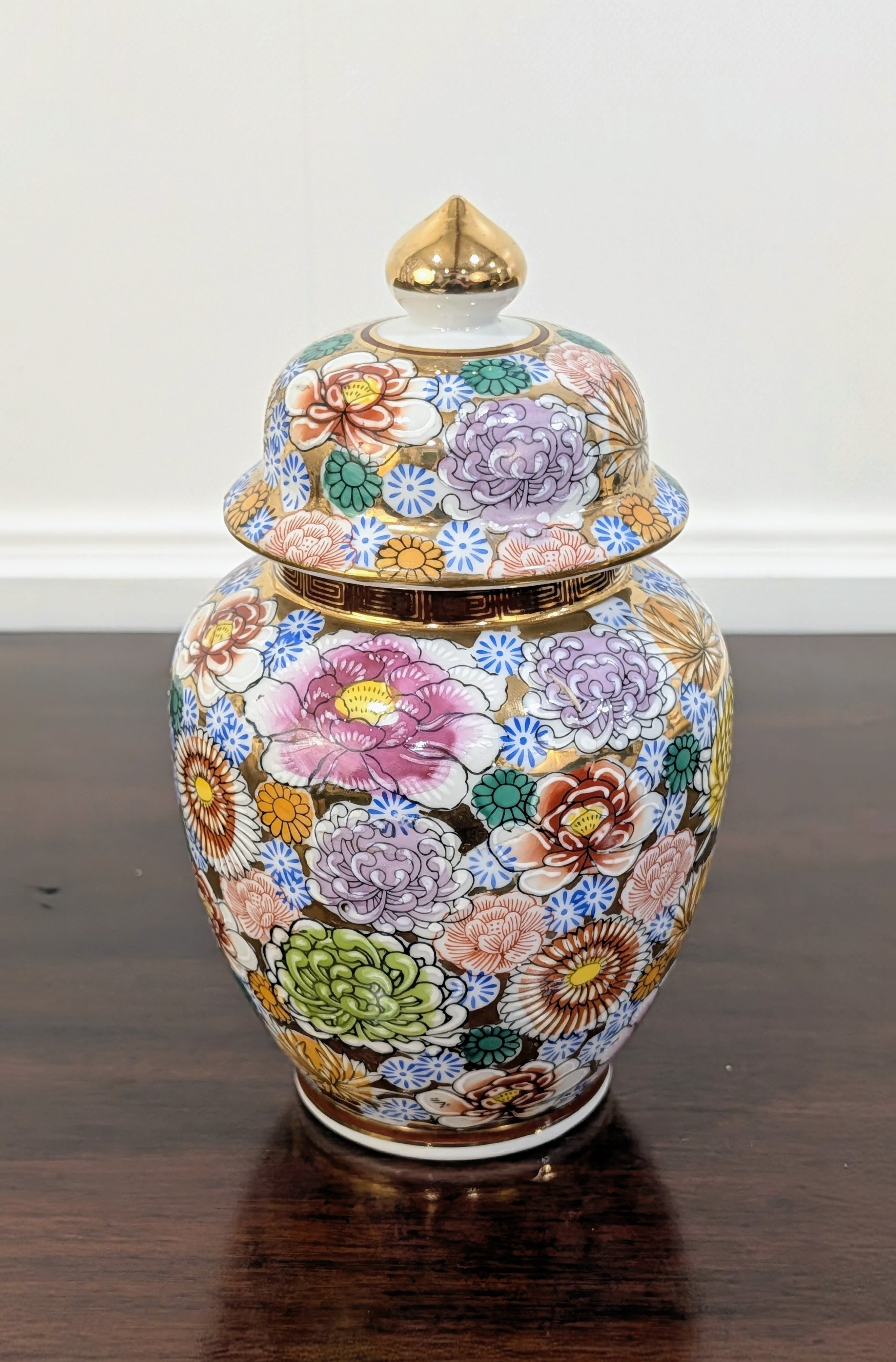 https://chairish-prod.freetls.fastly.net/image/product/master/445c8940-9ab7-455d-bb66-2034b859caa1/vintage-japanese-kutani-style-porcelain-ginger-jar-with-lid-floral-enamel-and-gold-5679